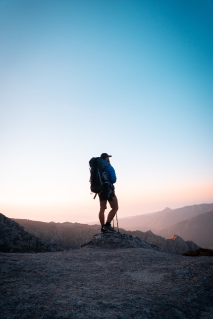 A person trekking with lightweight hiking gear. 