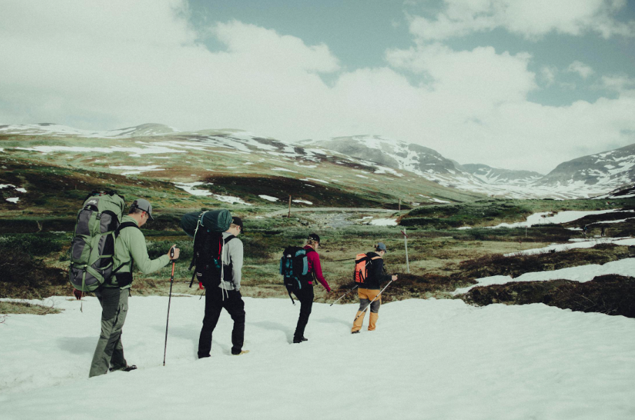 A group carrying high-performance ski backpacks. 