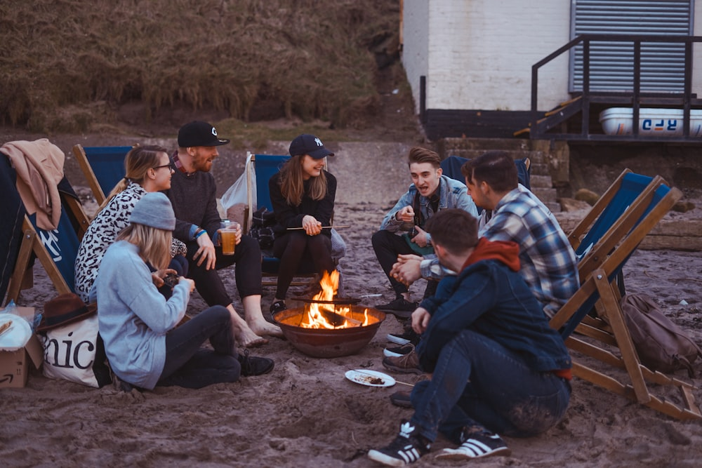 Friends sitting around a bonfire