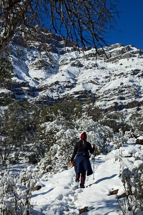 a woman trekking in the snow
